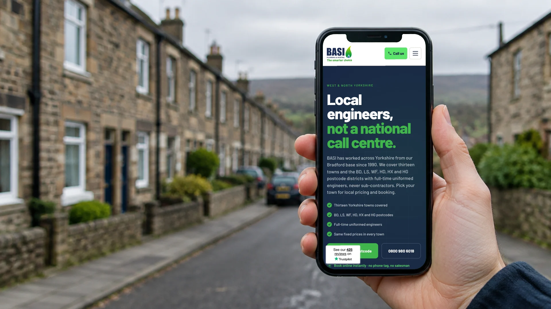 A hand holding a phone on a Yorkshire terraced street, showing the BASI Heating areas page: local engineers, not a national call centre