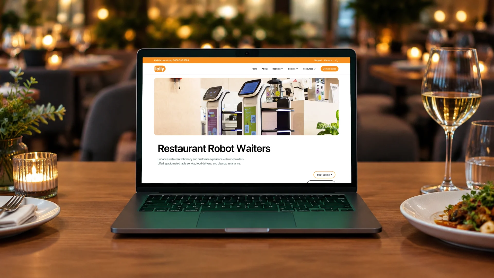 A laptop on a restaurant table showing the Lolly restaurant robot waiters product page